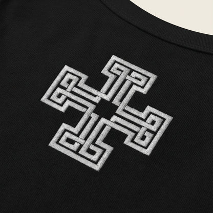 Black t-shirt with a white embroidered design on a beige background