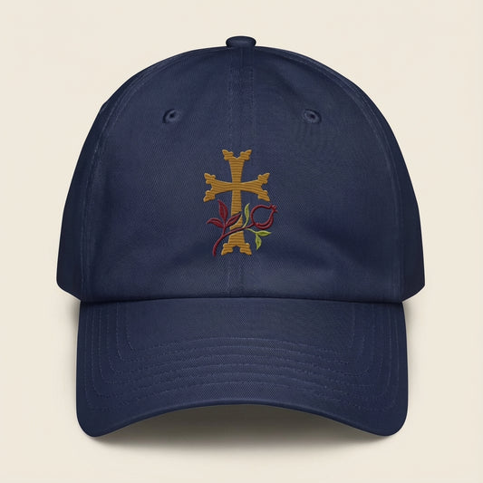 Navy blue cap with embroidered design on a beige background
