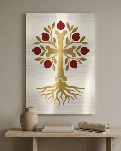 Decorative wall art with a gold cross and red pomegranates on a neutral background